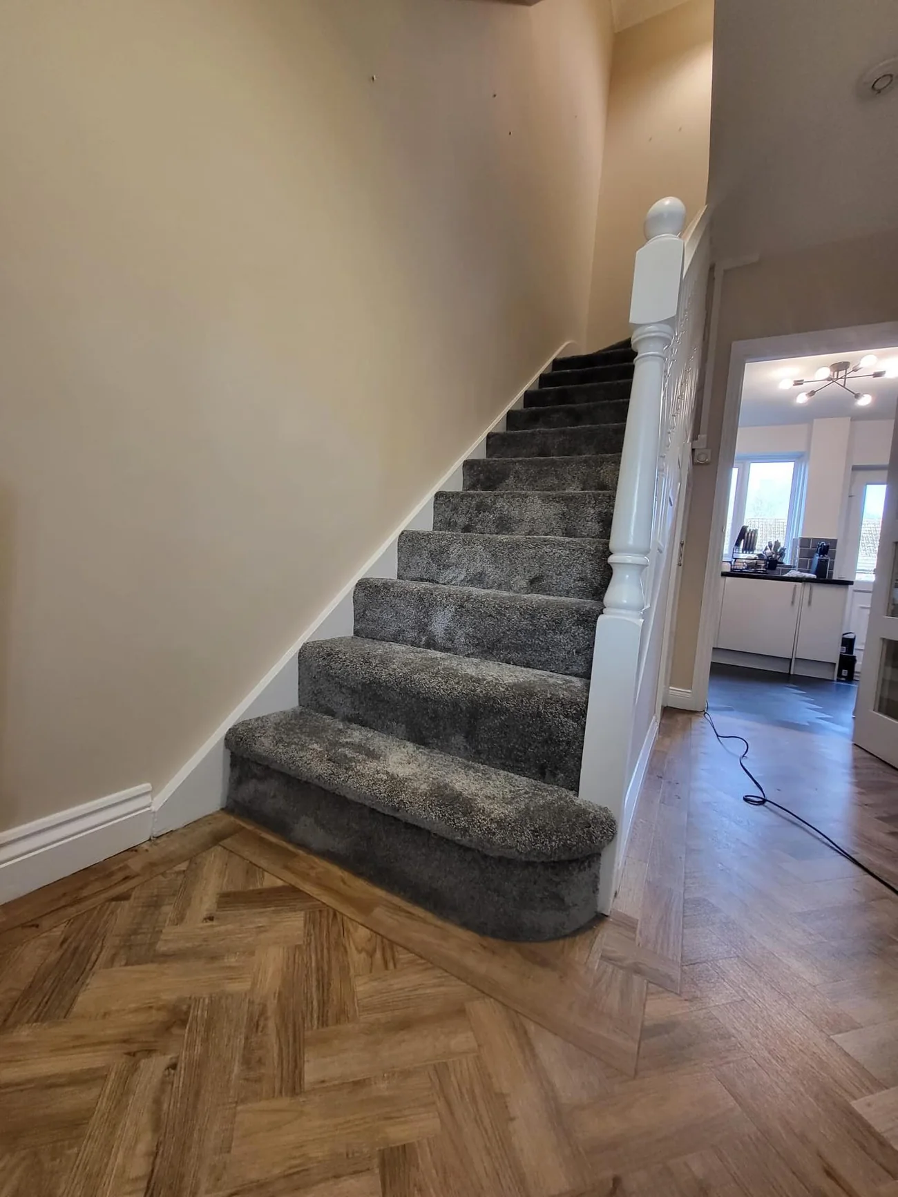 A grey stair carpet fitted edge to edge by Park Flooring