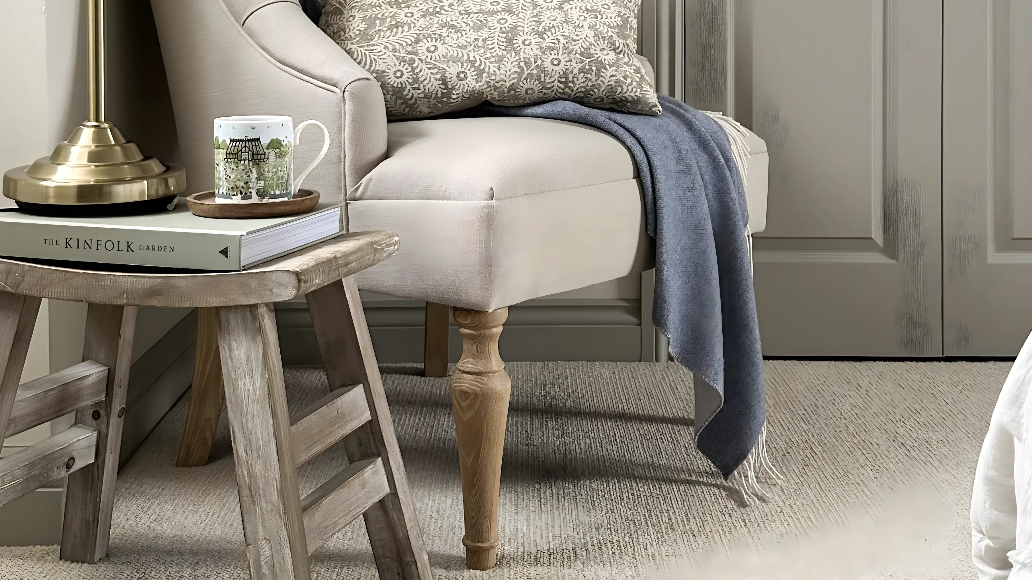 A bedroom chair on a soft neutral carpet in a period house