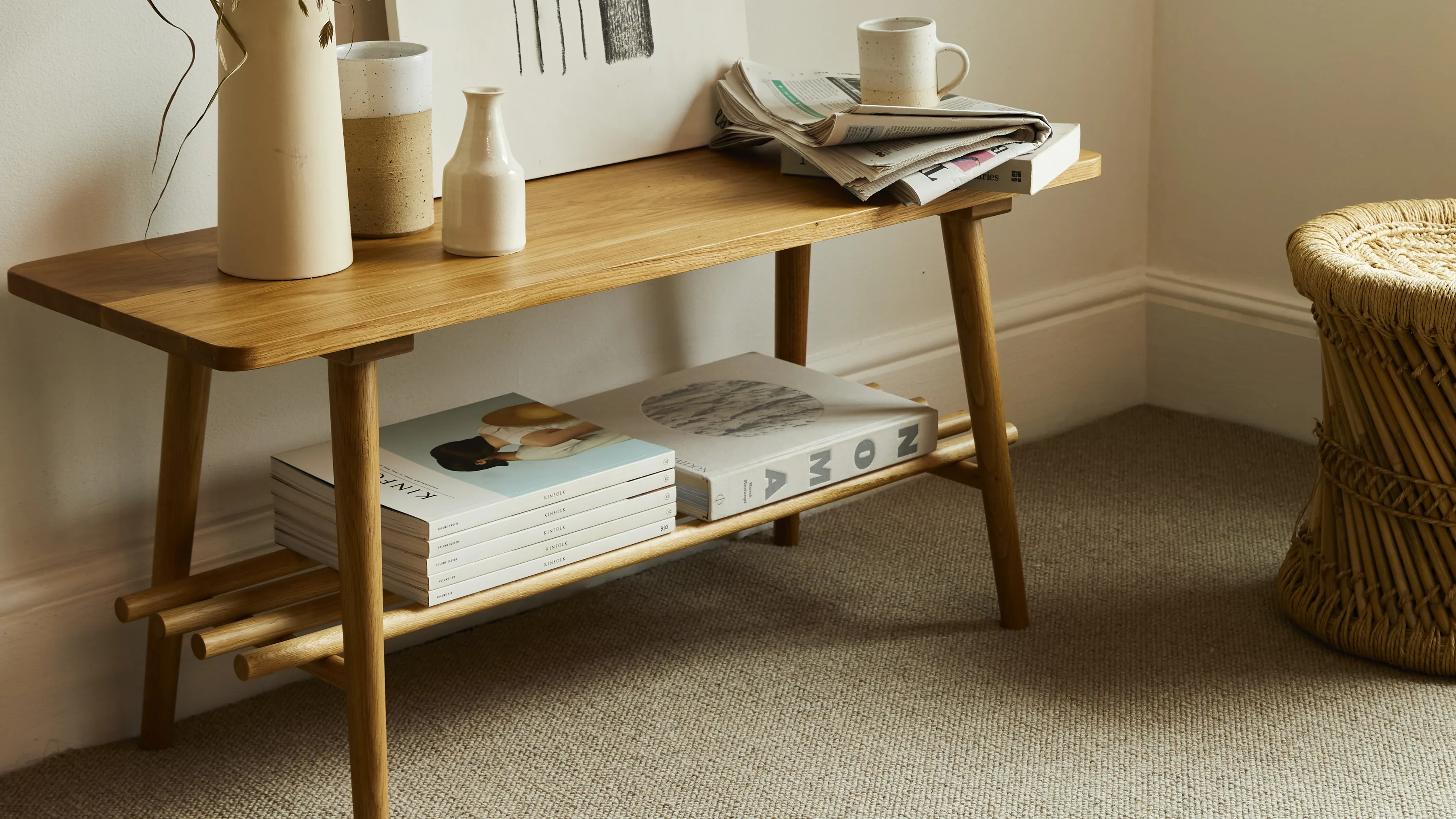 An oak bench on a soft cream loop carpet in a hallway