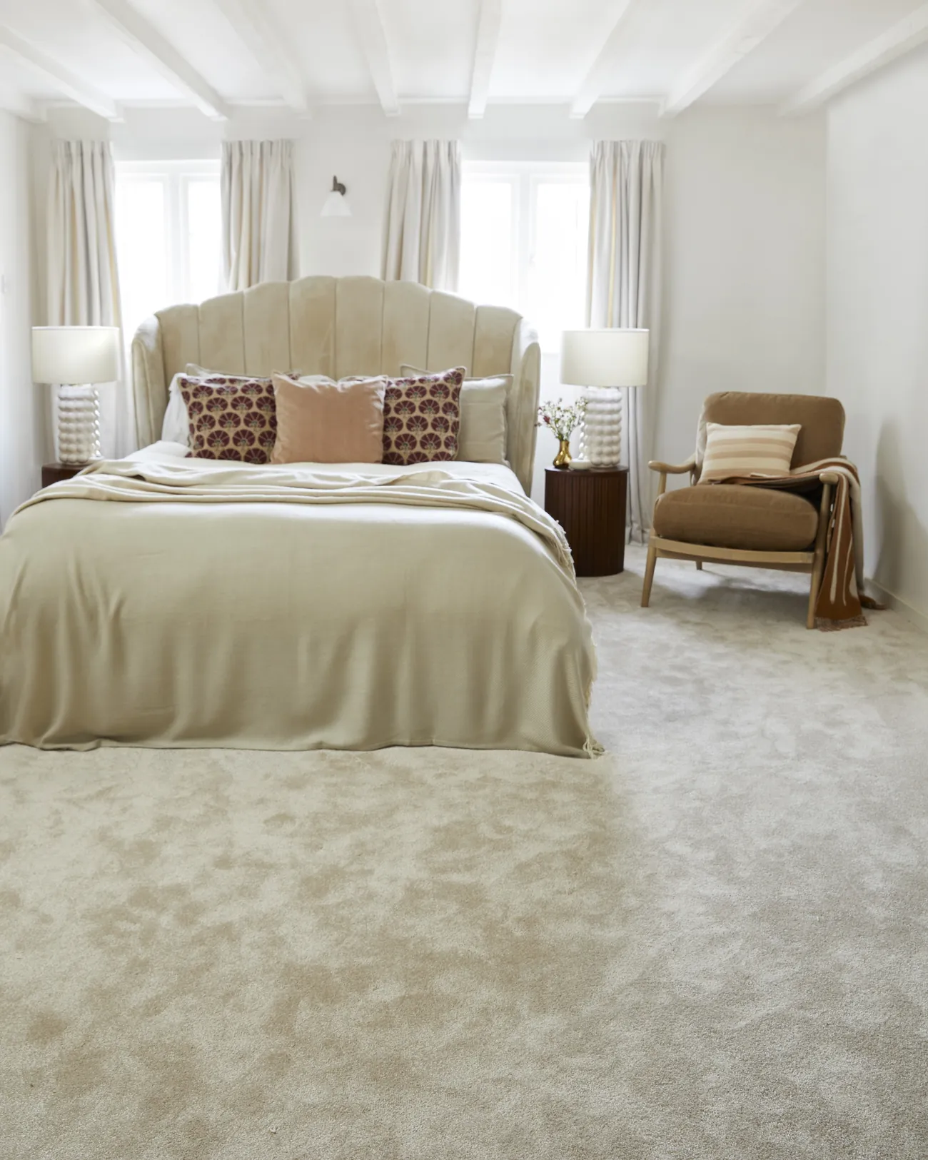 A calm bedroom with a deep pile carpet