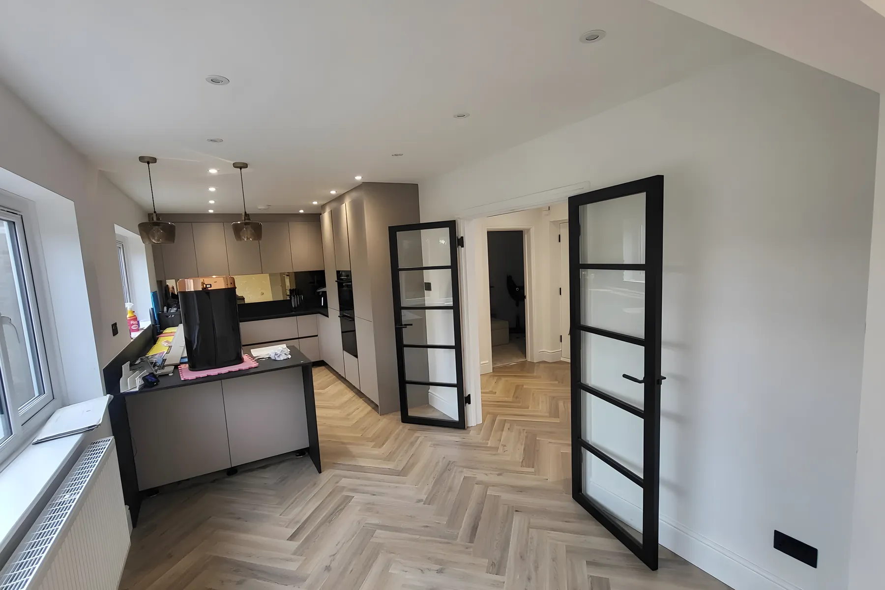 A kitchen with wood effect LVT flooring