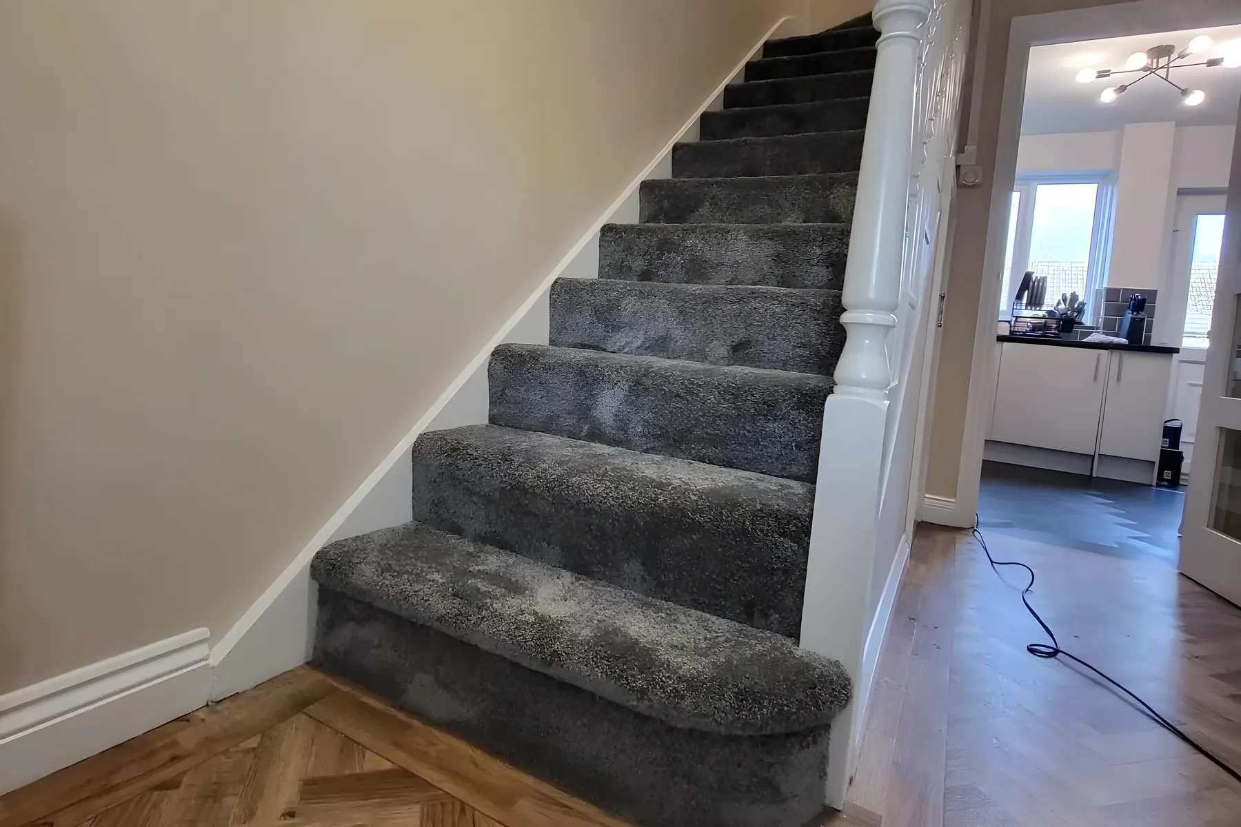 A grey stair carpet fitted by Park Flooring