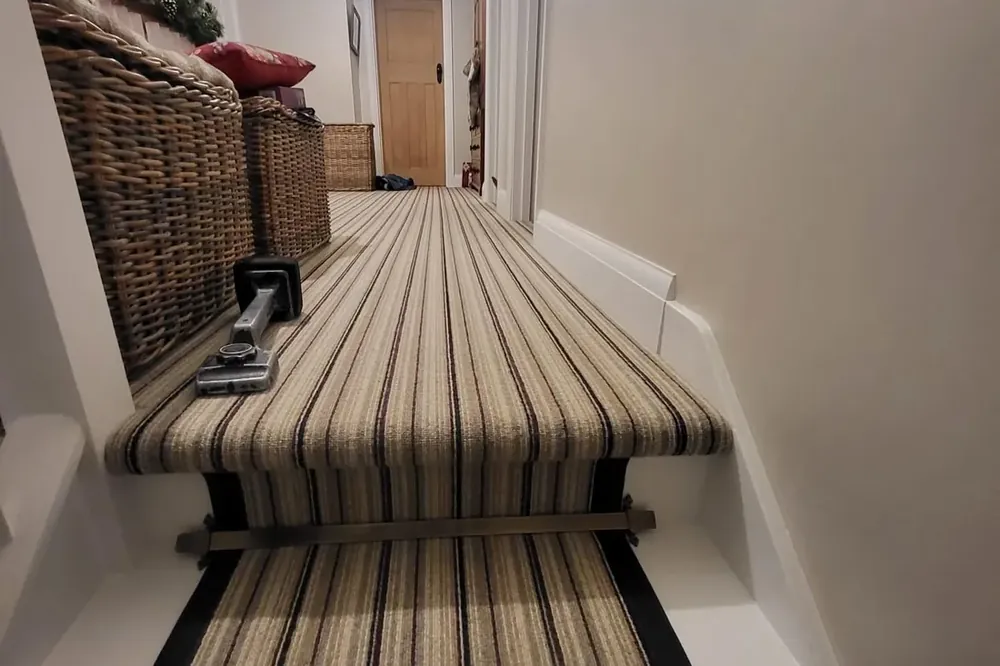 The striped runner fitted by Park Flooring, seen from the half landing