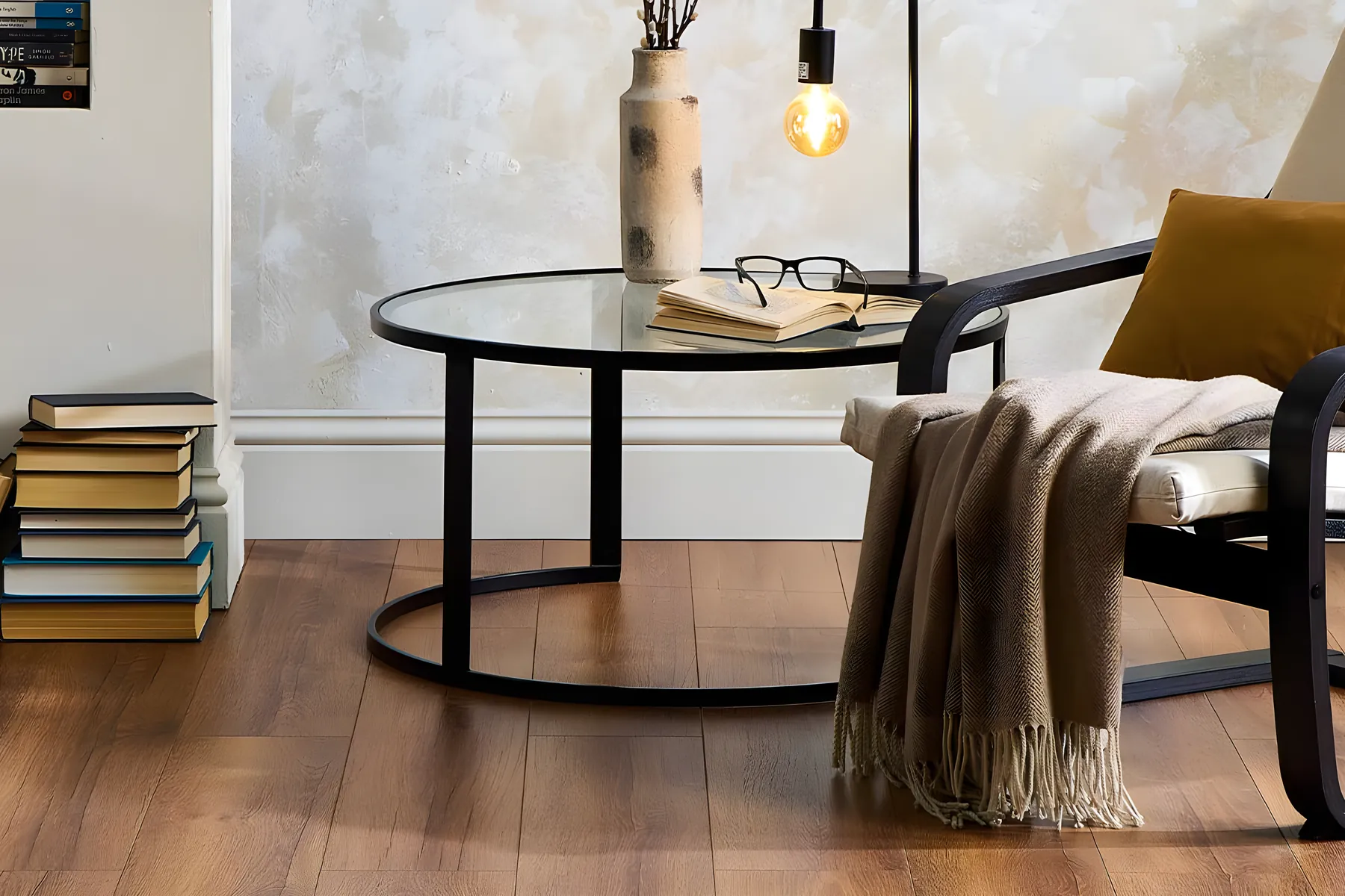 Oak laminate with a black chair, a side table and a stack of books